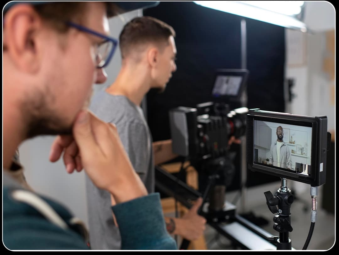 Filmmaker setting up lights at video production company studio